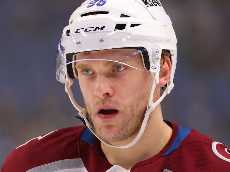 Dec 3, 2024; Buffalo, New York, USA;  Colorado Avalanche right wing Mikko Rantanen (96) waits for the face-off during the first period against the Buffalo Sabres at KeyBank Center. Mandatory Credit: Timothy T. Ludwig-Imagn Images