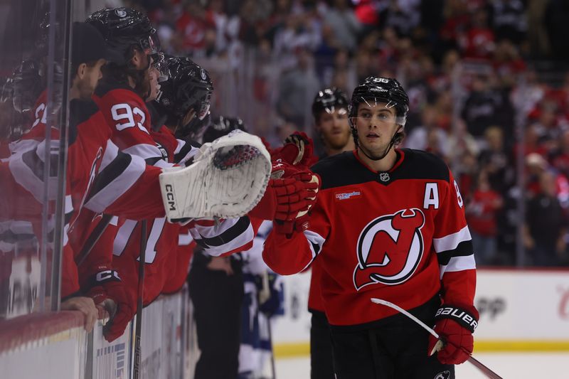 Oct 22, 2024; Newark, New Jersey, USA; New Jersey Devils center Jack Hughes (86) celebrates his goal against the Tampa Bay Lightning during the first period at Prudential Center. Mandatory Credit: Ed Mulholland-Imagn Images