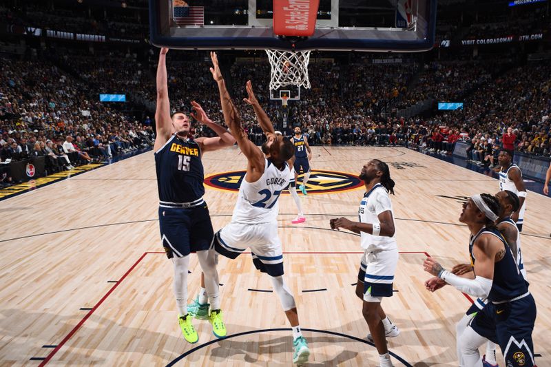 DENVER, CO - APRIL 10: Nikola Jokic #15 of the Denver Nuggets drives to the basket during the game against the Minnesota Timberwolves on April 10, 2024 at the Ball Arena in Denver, Colorado. NOTE TO USER: User expressly acknowledges and agrees that, by downloading and/or using this Photograph, user is consenting to the terms and conditions of the Getty Images License Agreement. Mandatory Copyright Notice: Copyright 2024 NBAE (Photo by Garrett Ellwood/NBAE via Getty Images)