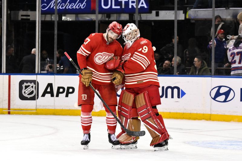Nov 16, 2025; New York, New York, USA; Detroit Red Wings center Michael Rasmussen (27) celebrates with goaltender Cam Talbot (39) after winning against the New York Rangers at Madison Square Garden. Mandatory Credit: John Jones-Imagn Images