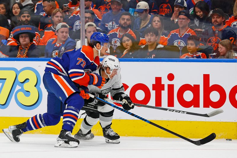 Apr 22, 2024; Edmonton, Alberta, CAN; Edmonton Oilers defensemen Vincent Desharnais (73) and Los Angeles Kings forward Blake Lizotte (46) battle along the boards for a loose puck during the second period in game one of the first round of the 2024 Stanley Cup Playoffs at Rogers Place. Mandatory Credit: Perry Nelson-USA TODAY Sports