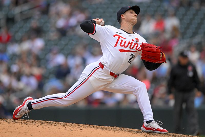 May 27, 2024; Minneapolis, Minnesota, USA; Minnesota Twins relief pitcher Griffin Jax (22) delivers a pitch against the Kansas City Royals during the eighth inning at Target Field. Mandatory Credit: Nick Wosika-USA TODAY Sports