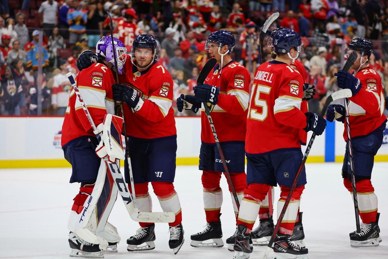 Nov 7, 2024; Sunrise, Florida, USA; Florida Panthers defenseman Dmitry Kulikov (7) celebrates with goaltender Sergei Bobrovsky (72) after the game against the Nashville Predators at Amerant Bank Arena. Mandatory Credit: Sam Navarro-Imagn Images