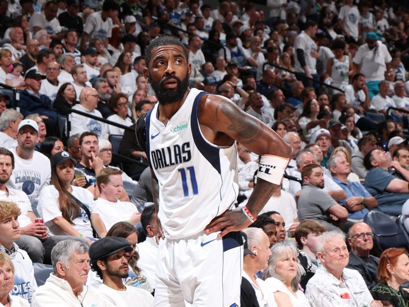 MINNEAPOLIS, MN - MAY 30: Kyrie Irving #11 of the Dallas Mavericks looks on during the game against the Minnesota Timberwolves during Game 5 of the Western Conference Finals during the 2024 NBA Playoffs on May 30, 2024 at Target Center in Minneapolis, Minnesota. NOTE TO USER: User expressly acknowledges and agrees that, by downloading and or using this Photograph, user is consenting to the terms and conditions of the Getty Images License Agreement. Mandatory Copyright Notice: Copyright 2024 NBAE (Photo by David Sherman/NBAE via Getty Images)