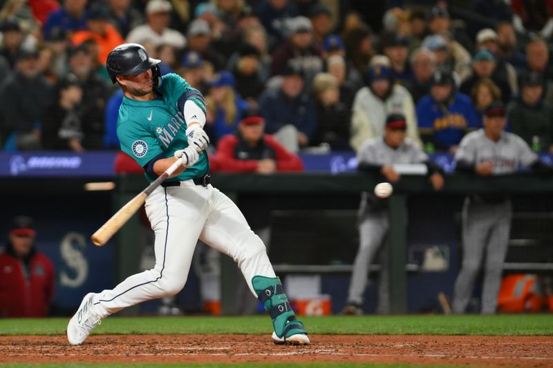 Apr 27, 2024; Seattle, Washington, USA; Seattle Mariners first baseman Ty France (23) hits a 2-run home run against the Arizona Diamondbacks during the seventh inning at T-Mobile Park. Mandatory Credit: Steven Bisig-USA TODAY Sports