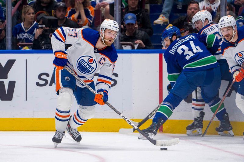 May 20, 2024; Vancouver, British Columbia, CAN; Edmonton Oilers forward Connor McDavid (97) looks to pass against the Vancouver Canucks during the second period in game seven of the second round of the 2024 Stanley Cup Playoffs at Rogers Arena. Mandatory Credit: Bob Frid-USA TODAY Sports