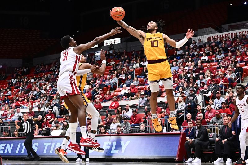 Jan 28, 2023; Pullman, Washington, USA; Arizona State Sun Devils guard Frankie Collins (10) rebounds the ball against Washington State Cougars guard Kymany Houinsou (31) in the second half at Friel Court at Beasley Coliseum. Washington State won 75-58. Mandatory Credit: James Snook-USA TODAY Sports