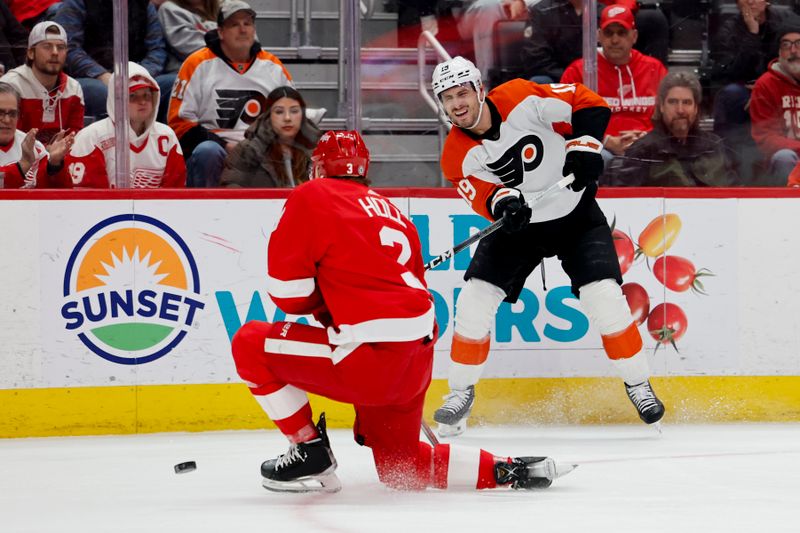 Jan 25, 2024; Detroit, Michigan, USA;  Philadelphia Flyers right wing Garnet Hathaway (19) takes a shot defended by Detroit Red Wings defenseman Justin Holl (3) in the first period at Little Caesars Arena. Mandatory Credit: Rick Osentoski-USA TODAY Sports