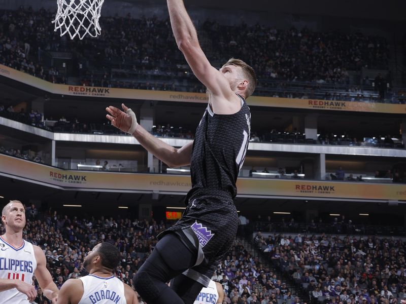 SACRAMENTO, CA - MARCH 3: Domantas Sabonis #10 of the Sacramento Kings drives to the basket during the game against the LA Clippers on March 3, 2023 at Golden 1 Center in Sacramento, California. NOTE TO USER: User expressly acknowledges and agrees that, by downloading and or using this Photograph, user is consenting to the terms and conditions of the Getty Images License Agreement. Mandatory Copyright Notice: Copyright 2023 NBAE (Photo by Rocky Widner/NBAE via Getty Images)