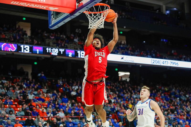 Jan 16, 2024; Boise, Idaho, USA; UNLV Rebels forward Rob Whaley Jr. (5) attempts a dunk during the first half against the Boise State Broncos at ExtraMile Arena. Mandatory Credit: Brian Losness-USA TODAY Sports

