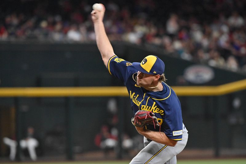 Apr 11, 2025; Phoenix, Arizona, USA; Milwaukee Brewers pitcher Trevor Megill (29) throws in the ninth inning against the Arizona Diamondbacks at Chase Field. Mandatory Credit: Matt Kartozian-Imagn Images