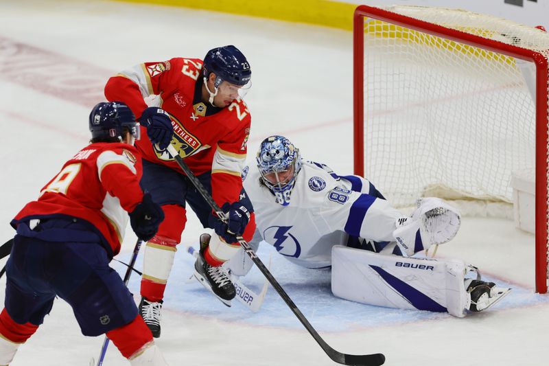 Apr 23, 2024; Sunrise, Florida, USA; Florida Panthers center Carter Verhaeghe (23) shoots the puck and scores against Tampa Bay Lightning goaltender Andrei Vasilevskiy (88) during overtime in game two of the first round of the 2024 Stanley Cup Playoffs at Amerant Bank Arena. Mandatory Credit: Sam Navarro-USA TODAY Sports