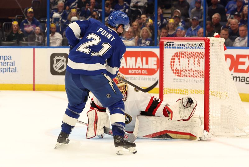 Apr 11, 2024; Tampa, Florida, USA; Ottawa Senators goaltender Anton Forsberg (31) makes a save from Tampa Bay Lightning center Brayden Point (21) during a shoot out at Amalie Arena. Mandatory Credit: Kim Klement Neitzel-USA TODAY Sports