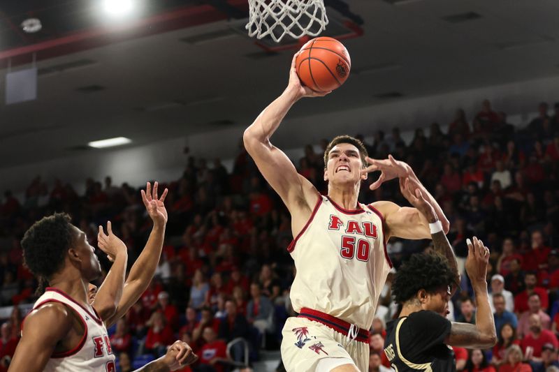 Jan 14, 2024; Boca Raton, Florida, USA; Florida Atlantic Owls center Vladislav Goldin (50) drives to the basket against the UAB Blazers during the second half at Eleanor R. Baldwin Arena. Mandatory Credit: Sam Navarro-USA TODAY Sports