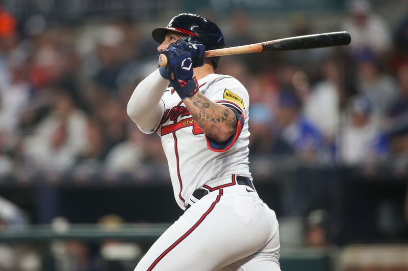 Sep 26, 2023; Atlanta, Georgia, USA; Atlanta Braves left fielder Kevin Pillar (17) hits a home run against the Chicago Cubs in the sixth inning at Truist Park. Mandatory Credit: Brett Davis-USA TODAY Sports
