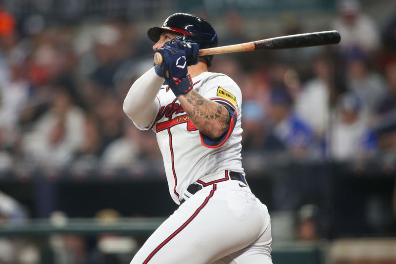 Sep 26, 2023; Atlanta, Georgia, USA; Atlanta Braves left fielder Kevin Pillar (17) hits a home run against the Chicago Cubs in the sixth inning at Truist Park. Mandatory Credit: Brett Davis-USA TODAY Sports
