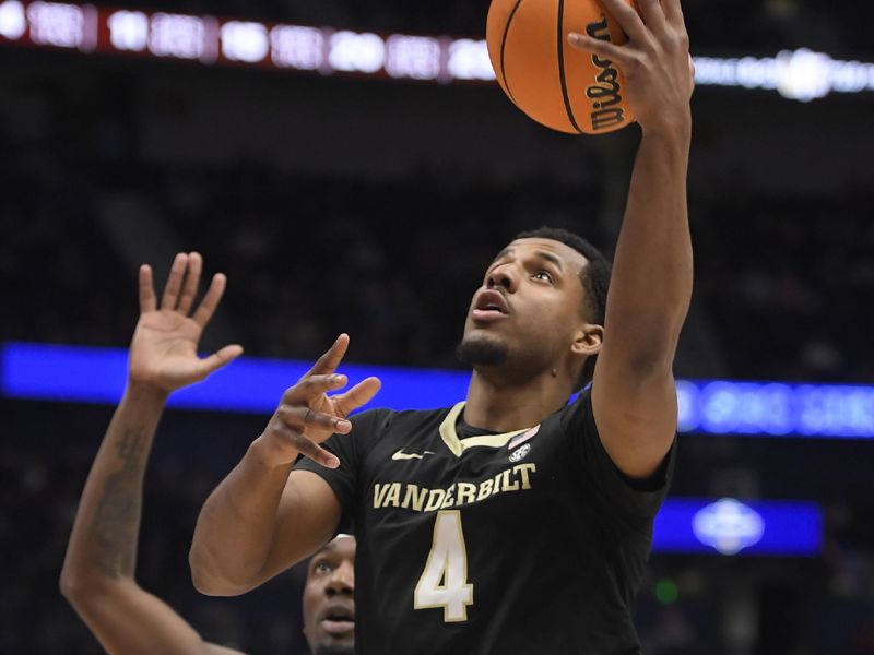 Mar 11, 2023; Nashville, TN, USA;  Vanderbilt Commodores guard Jordan Wright (4) takes a shot against the Texas A&M during the first half at Bridgestone Arena. Mandatory Credit: Steve Roberts-USA TODAY Sports