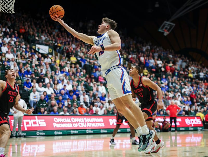 Jan 30, 2024; Fort Collins, Colorado, USA; Colorado State Rams forward Patrick Cartier (12) drives to the basket against the San Diego State Aztecs during the 2nd half at Moby Arena. Mandatory Credit: Chet Strange-USA TODAY Sports