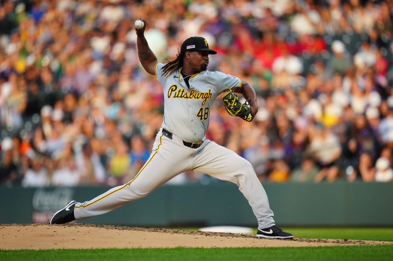 Jun 14, 2024; Denver, Colorado, USA; Pittsburgh Pirates relief pitcher Luis L. Ortiz (48) delvers a pitch in the fifth inning against the Colorado Rockies at Coors Field. Mandatory Credit: Ron Chenoy-USA TODAY Sports