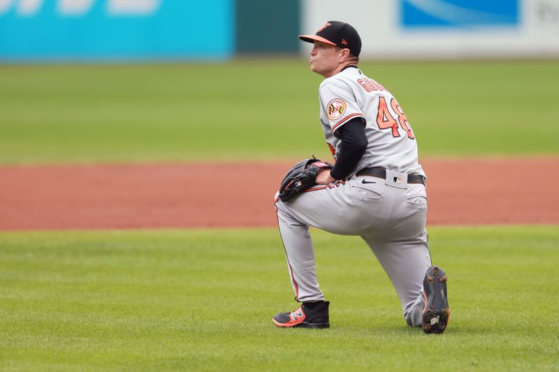 Sep 24, 2023; Cleveland, Ohio, USA; Baltimore Orioles starting pitcher Kyle Gibson (48) gets up after being hit on the foot by a ball hit by the Cleveland Guardians third baseman Jose Ramirez (11) during the first inning at Progressive Field. Mandatory Credit: Aaron Josefczyk-USA TODAY Sports