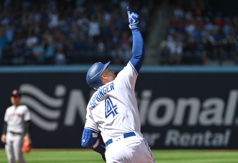 Aug 27, 2023; Toronto, Ontario, CAN;  Toronto Blue Jays right fielder George Springer (4) celebrates after hitting a solo home run against the Cleveland Guardians in the fourth inning at Rogers Centre. Mandatory Credit: Dan Hamilton-USA TODAY Sports