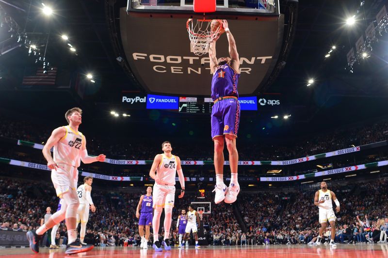 PHOENIX, AZ - JANUARY 11: Devin Booker #1 of the Phoenix Suns dunks the ball during the game against the Utah Jazz on January 11, 2025 at Footprint Center in Phoenix, Arizona. NOTE TO USER: User expressly acknowledges and agrees that, by downloading and or using this photograph, user is consenting to the terms and conditions of the Getty Images License Agreement. Mandatory Copyright Notice: Copyright 2025 NBAE (Photo by Kate Frese/NBAE via Getty Images)