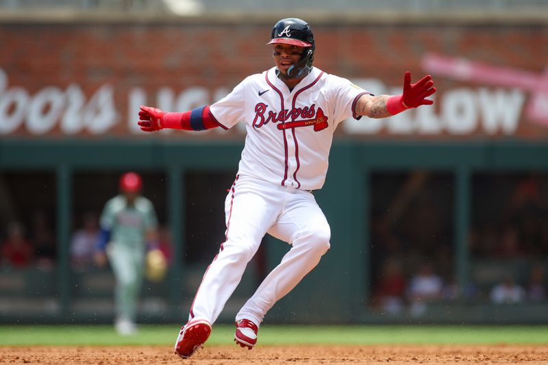 Jul 7, 2024; Atlanta, Georgia, USA; Atlanta Braves shortstop Orlando Arcia (11) runs the bases against the Philadelphia Phillies in the second inning at Truist Park. Mandatory Credit: Brett Davis-USA TODAY Sports
