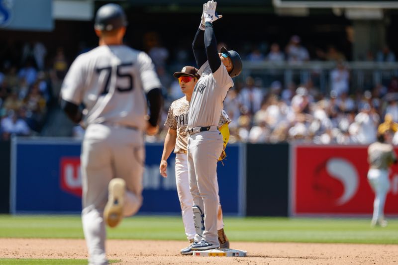 May 26, 2024; San Diego, California, USA; New York Yankees right fielder Juan Soto (22) celebrates at second base after hitting a rbi double in the sixth inning against the San Diego Padres at Petco Park. Mandatory Credit: David Frerker-USA TODAY Sports