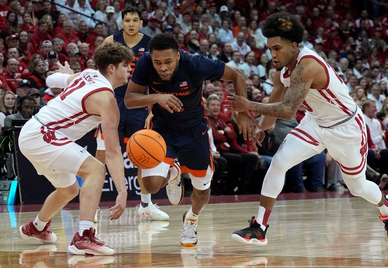 Jan 1, 2023; Madison, Wis, USA; Illinois guard Jayden Epps (3) is fouled by Wisconsin guard Chucky Hepburn (23) and guard Max Klesmit (11) looks on during the first half of their game at the Kohl Center. Mandatory Credit: Mark Hoffman/Milwaukee Journal Sentinel via USA TODAY NETWORK