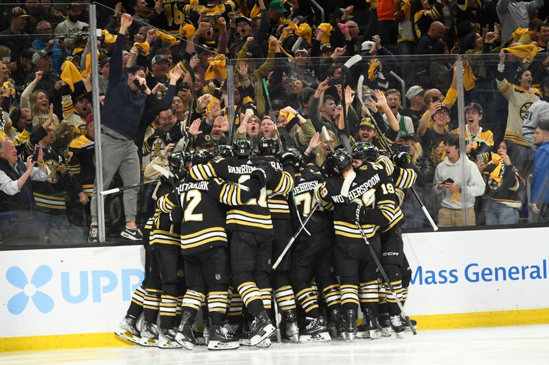 May 4, 2024; Boston, Massachusetts, USA; The Boston Bruins celebrate after defeating the Toronto Maple Leafs in overtime in game seven of the first round of the 2024 Stanley Cup Playoffs at TD Garden. Mandatory Credit: Bob DeChiara-USA TODAY Sports