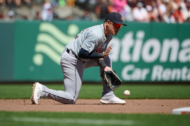 Aug 10, 2024; San Francisco, California, USA; Detroit Tigers infielder Gio Urshela (13) makes a fielding error against the San Francisco Giants during the eighth inning at Oracle Park. Mandatory Credit: Robert Edwards-USA TODAY Sports