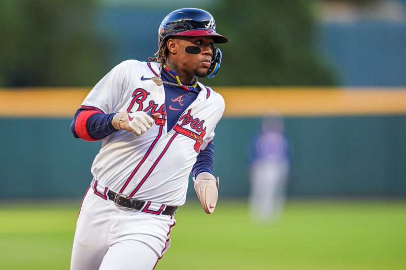 Apr 21, 2024; Cumberland, Georgia, USA; Atlanta Braves right fielder Ronald Acuna Jr (13) runs the bases against the Texas Rangers during the first inning at Truist Park. Mandatory Credit: Dale Zanine-USA TODAY Sports