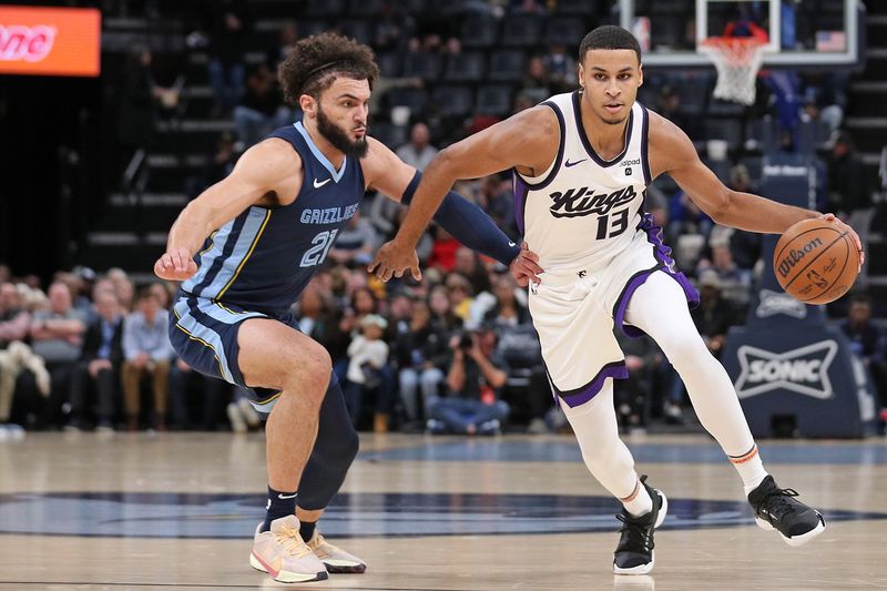 MEMPHIS, TENNESSEE - JANUARY 29: Keegan Murray #13 of the Sacramento Kings handles the ball against David Roddy #21 of the Memphis Grizzlies during the first half at FedExForum on January 29, 2024 in Memphis, Tennessee. NOTE TO USER: User expressly acknowledges and agrees that, by downloading and or using this photograph, User is consenting to the terms and conditions of the Getty Images License Agreement. (Photo by Justin Ford/Getty Images)