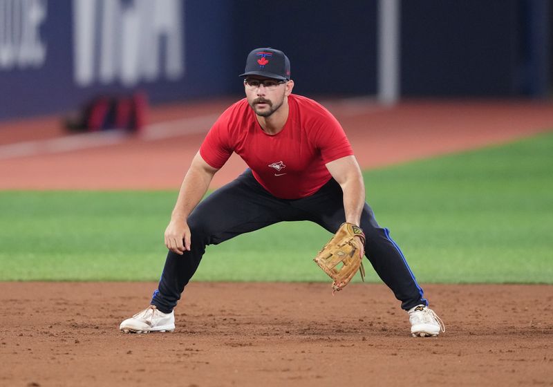 Jun 19, 2024; Toronto, Ontario, CAN; Toronto Blue Jays outfielder Davis Schneider (36) fields balls during batting practice before game against the Boston Red Sox at Rogers Centre. Mandatory Credit: Nick Turchiaro-USA TODAY Sports