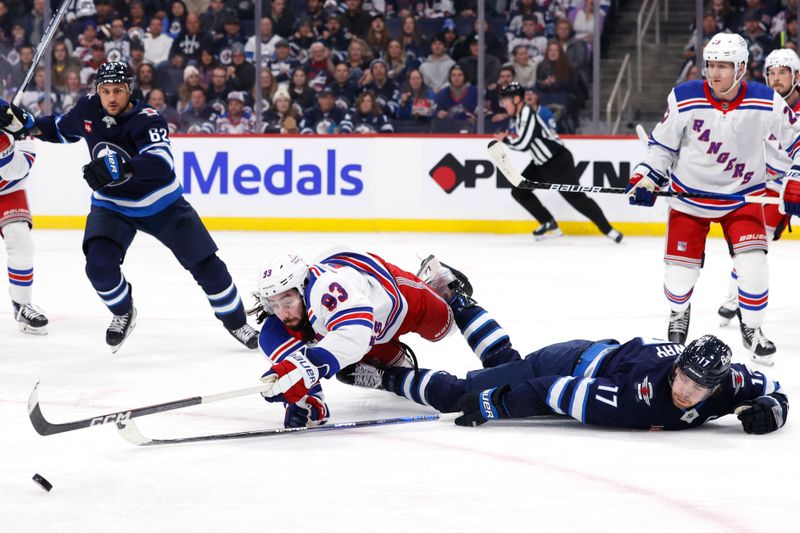 Oct 30, 2023; Winnipeg, Manitoba, CAN; New York Rangers center Mika Zibanejad (93) and Winnipeg Jets center Adam Lowry (17) stretch for the puck in the second period at Canada Life Centre. Mandatory Credit: James Carey Lauder-USA TODAY Sports