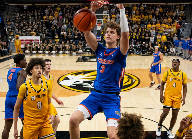 Jan 20, 2024; Columbia, Missouri, USA; Florida Gators center Micah Handlogten (3) dunks the ball against the Missouri Tigers during the first half at Mizzou Arena. Mandatory Credit: Jay Biggerstaff-USA TODAY Sports