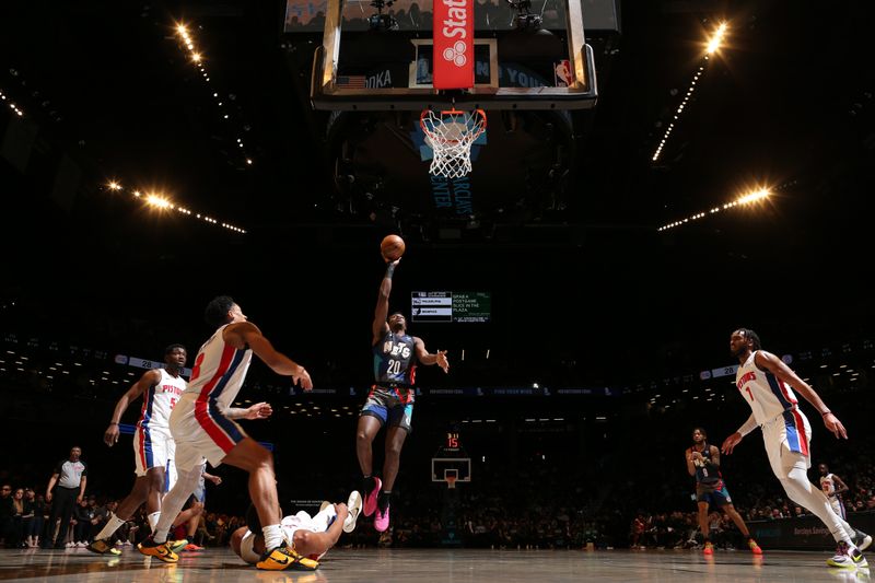 BROOKLYN, NY - APRIL 6: Day'Ron Sharpe #20 of the Brooklyn Nets drives to the basket during the game against the Detroit Pistons on April 6, 2024 at Barclays Center in Brooklyn, New York. NOTE TO USER: User expressly acknowledges and agrees that, by downloading and or using this Photograph, user is consenting to the terms and conditions of the Getty Images License Agreement. Mandatory Copyright Notice: Copyright 2024 NBAE (Photo by Nathaniel S. Butler/NBAE via Getty Images)