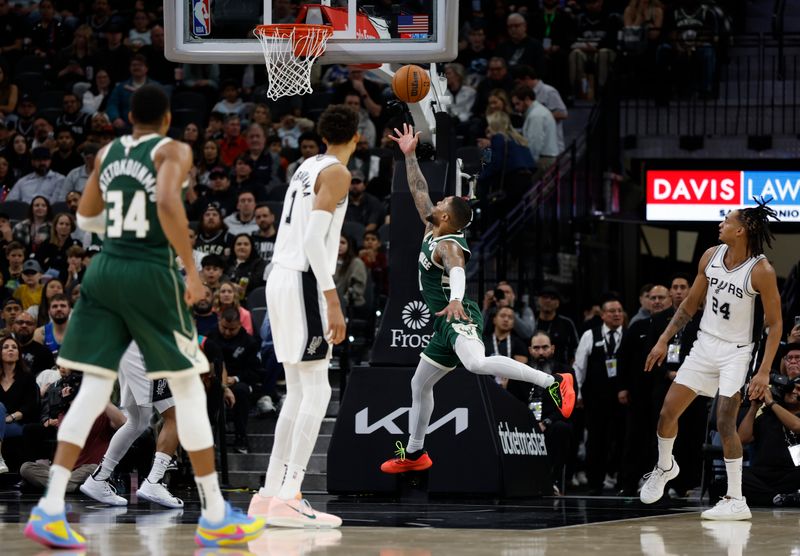 SAN ANTONIO, TX - JANUARY 31: Damian Lillard #0 of the Milwaukee Bucks drives past Victor Wembanyama #1 of the San Antonio Spurs in the first half at Frost Bank Center on January 31, 2025 in San Antonio, Texas. NOTE TO USER: User expressly acknowledges and agrees that, by downloading and or using this photograph, User is consenting to terms and conditions of the Getty Images License Agreement. (Photo by Ronald Cortes/Getty Images)