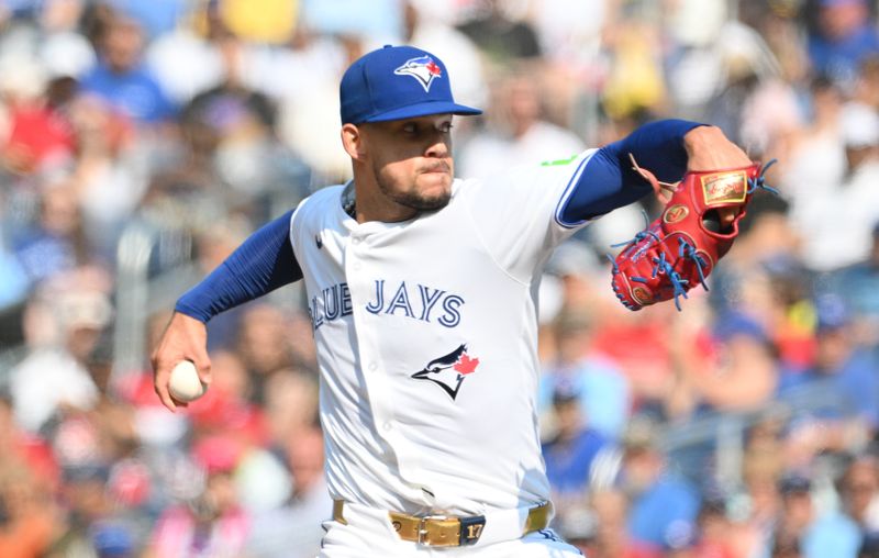 Sep 14, 2024; Toronto, Ontario, CAN;  Toronto Blue Jays starting pitcher Jose Berrios (17) delivers a pitch against the St. Louis Cardinals in the first inning at Rogers Centre. Mandatory Credit: Dan Hamilton-Imagn Images