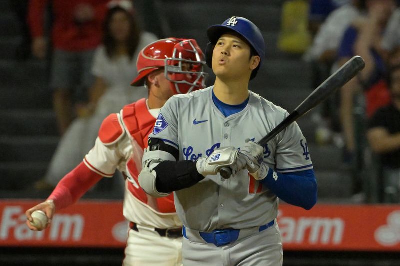 Sep 3, 2024; Anaheim, California, USA;  Los Angeles Dodgers designated hitter Shohei Ohtani (17) reacts as he was called out on strikes in the fifth inning against the Los Angeles Angels at Angel Stadium. Mandatory Credit: Jayne Kamin-Oncea-Imagn Images