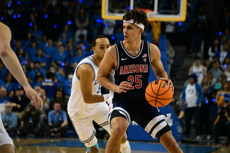 Mar 4, 2023; Los Angeles, California, USA;  Arizona Wildcats guard Kerr Kriisa (25) controls the ball as UCLA Bruins defends during the first half at Pauley Pavilion presented by Wescom. Mandatory Credit: Richard Mackson-USA TODAY Sports