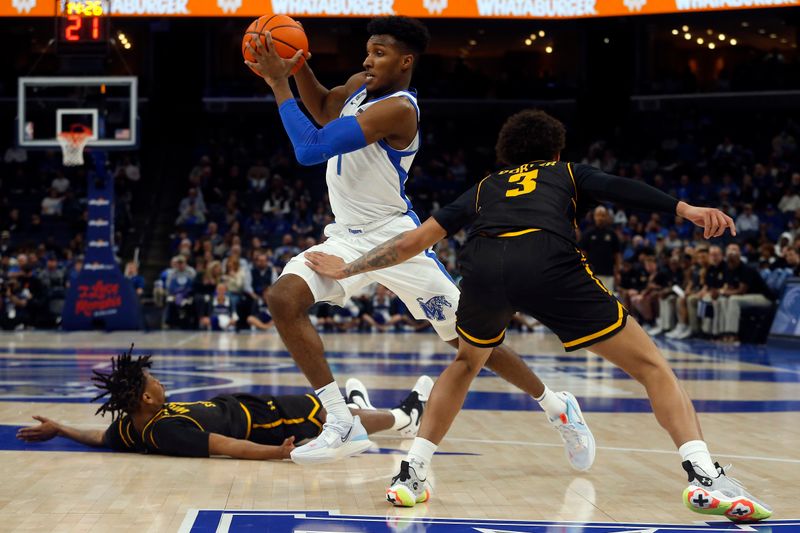 Jan 19, 2023; Memphis, Tennessee, USA; Memphis Tigers guard Keonte Kennedy (1) drives to the basket as Wichita State Shockers guard Craig Porter Jr. (3) defends during the second half at FedExForum. Mandatory Credit: Petre Thomas-USA TODAY Sports