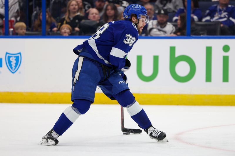 Jan 28, 2023; Tampa, Florida, USA;  Tampa Bay Lightning left wing Brandon Hagel (38) shoots the puck against the Los Angeles Kings in the third period at Amalie Arena. Mandatory Credit: Nathan Ray Seebeck-USA TODAY Sports