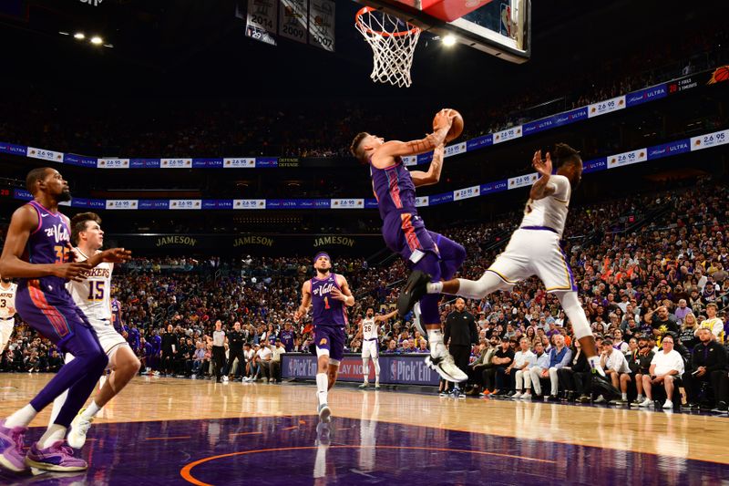 PHOENIX, AZ - FEBRUARY 25: Grayson Allen #8 of the Phoenix Suns drives to the basket during the game against the Los Angeles Lakers on February 25, 2024 at Footprint Center in Phoenix, Arizona. NOTE TO USER: User expressly acknowledges and agrees that, by downloading and or using this photograph, user is consenting to the terms and conditions of the Getty Images License Agreement. Mandatory Copyright Notice: Copyright 2024 NBAE (Photo by Kate Frese/NBAE via Getty Images)