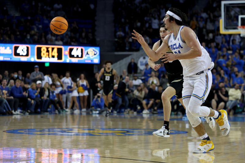 Jan 14, 2023; Los Angeles, California, USA;  UCLA Bruins guard Jaime Jaquez Jr. (24) passes the ball during the second half against the Colorado Buffaloes at Pauley Pavilion presented by Wescom. Mandatory Credit: Kiyoshi Mio-USA TODAY Sports