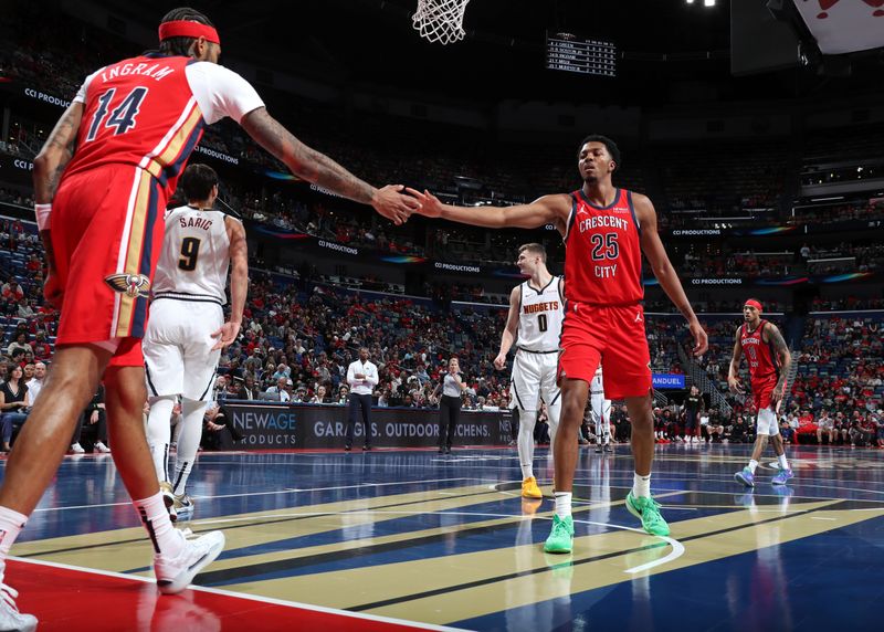 NEW ORLEANS, LA - NOVEMBER 15: Brandon Ingram #14 and Trey Murphy III #25 of the New Orleans Pelicans high five during the game against the Denver Nuggets during the Emirates NBA Cup game on November 15, 2024 at the Smoothie King Center in New Orleans, Louisiana. NOTE TO USER: User expressly acknowledges and agrees that, by downloading and or using this Photograph, user is consenting to the terms and conditions of the Getty Images License Agreement. Mandatory Copyright Notice: Copyright 2024 NBAE (Photo by Layne Murdoch Jr./NBAE via Getty Images)