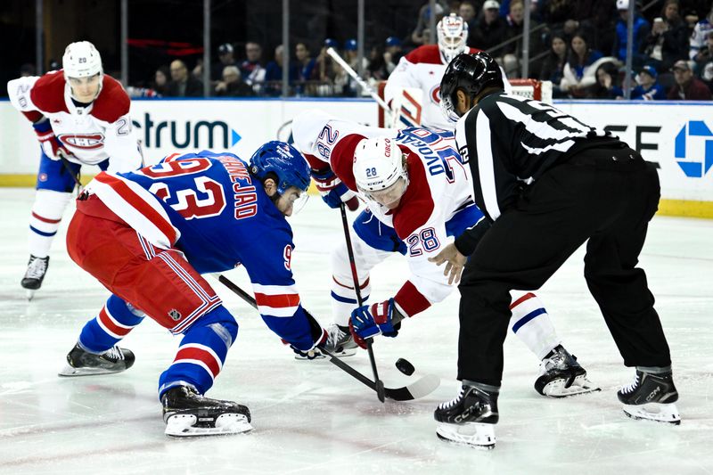 Nov 30, 2024; New York, New York, USA; New York Rangers center Mika Zibanejad (93) faces off against Montreal Canadiens center Christian Dvorak (28) during the first period at Madison Square Garden. Mandatory Credit: John Jones-Imagn Images