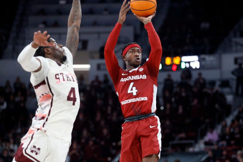 Feb 17, 2024; Starkville, Mississippi, USA; Arkansas Razorbacks guard Davonte Davis (4) shoots the ball against the Mississippi State Bulldogs during the second half at Humphrey Coliseum. Mandatory Credit: Petre Thomas-USA TODAY Sports