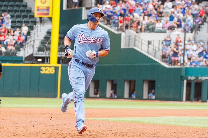 May 21, 2023; Arlington, Texas, USA; Texas Rangers designated hitter Corey Seager (5) hits a home run during the second inning against the Colorado Rockies at Globe Life Field. Mandatory Credit: Andrew Dieb-USA TODAY Sports