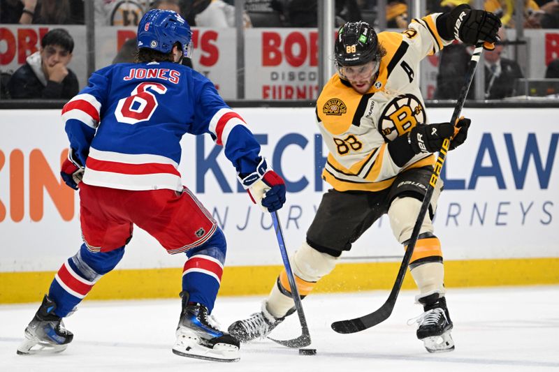 Mar 21, 2024; Boston, Massachusetts, USA; Boston Bruins right wing David Pastrnak (88) skates against New York Rangers defenseman Zac Jones (6) during the third period at the TD Garden. Mandatory Credit: Brian Fluharty-USA TODAY Sports